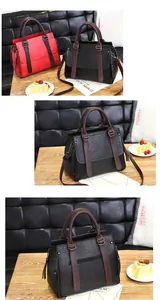 Detail of lychee pattern leather handbag with contrast stitching and metal buckles