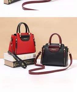 Detailed shot of color-block tote bags in red and black with lychee grain texture