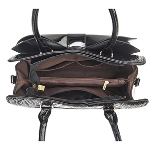 Glossy black patent leather handbag featuring triple compartments and golden hardware