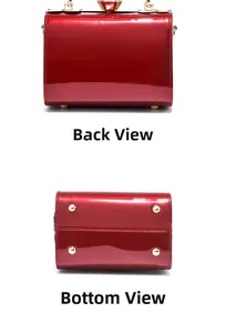 Detail view of red patent leather handbag showing the flat back and protective gold feet