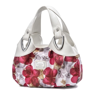 Women's white leather tote bag with red floral pattern and silver brand plaque