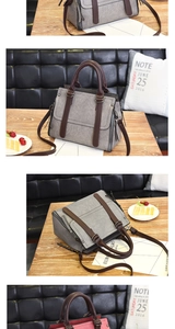 Detailed view of gray vintage leather tote bag with side zippers and bronze hardware