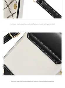 Détails des ferrures dorées et de la bandoulière de la pochette de téléphone chic