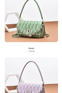 Detail showing wavy pleats and sparkling rhinestone buckles on lavender and green bags