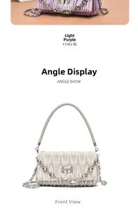Detail of Matelassé quilted chain bag with crystal decoration in lavender and off-white