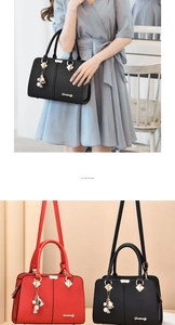 Detail view of stylish leather handbag showing tassel charm and metallic diamond hardware