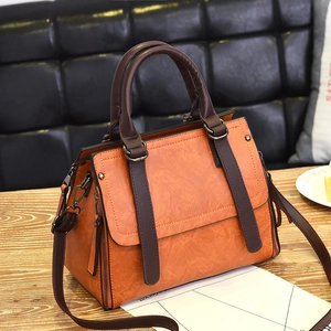 Fashionable orange and dark brown contrast leather tote bag with a retro trapezoid shape