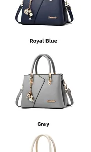 Detailed view of lychee pattern leather handbags in royal blue and grey with floral charms
