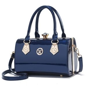 Glossy navy blue patent leather handbag with gold logo and rhinestone clasp detail