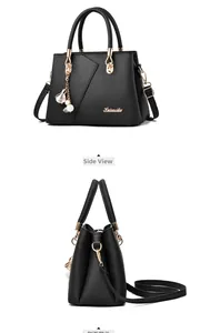 Detailed side view of black lychee grain leather tote bag with gold metal hardware