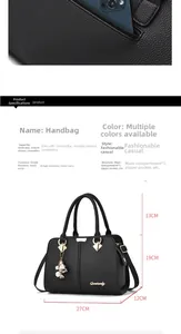 Detailed view of black litchi pattern handbag with dimensions 27cm x 19cm x 12cm