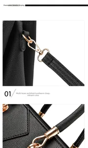 Detail of gold metal hardware and lychee grain leather texture on the handbag