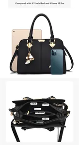 Internal view of black tote bag showing multi-pocket storage and large capacity