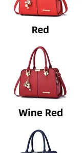 Detail view of large capacity faux leather handbags in red, burgundy and dark blue