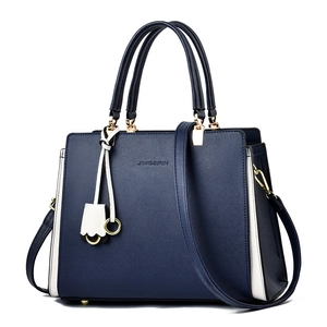 Navy blue and white contrast leather handbag with gold hardware and top handles