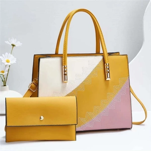 Detailed close-up of a three-color patchwork tote bag set with precise wavy stitching and hardware