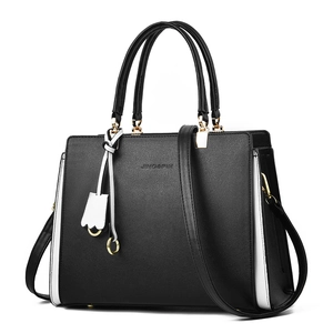 Classic black and white leather tote handbag with gold hardware and top handles