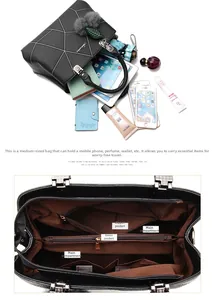 Internal view of women's black handbag showing spacious compartments and storage capacity