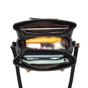 Black litchi pattern leather handbag with large capacity showing internal compartments