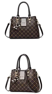 Macro shot of faux leather texture with floral monogram print and hardware buckle details