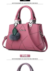 Detail of rubber pink tote bag with litchi grain texture and embroidery pattern