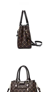 Detail view of large capacity tote bag with star patterns and gold-tone side zippers