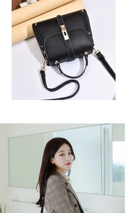 Close-up of black lychee grain leather handbag with gold metal hardware and stitching