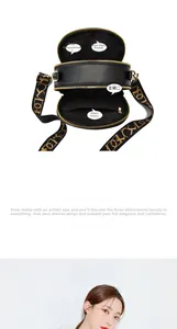 Detail view of black PU leather bag interior compartments and patterned strap