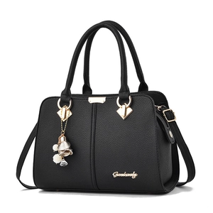 Classic black litchi texture handbag with gold hardware and floral pearl pendant