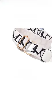 Adjustable canvas shoulder strap with black letter prints and gold metal hardware buckles