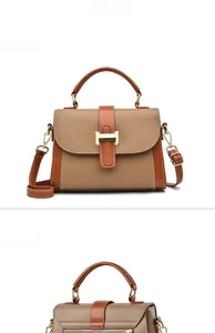 Front and back views of a vintage brown lychee leather crossbody bag with gold buckle
