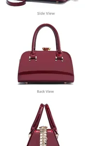 Detail view of burgundy patent leather bag showing side and back profiles with crystal clasp