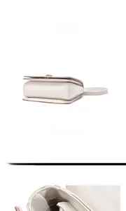 Detail view of multicolored crossbody bag showing interior and golden metal lock
