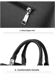 Macro view of silver zipper hardware and ergonomic leather handle on black tote bag