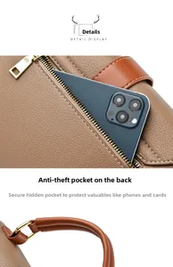 Detail view of brown pebbled leather bag with a secure back anti-theft zipper pocket