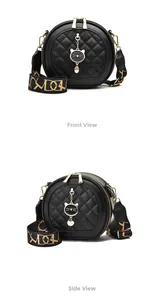 Detail of round quilted crossbody bag with cat charm and wide patterned shoulder strap