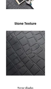 Macro detail of black crocodile pattern leather texture with decorative silk scarf