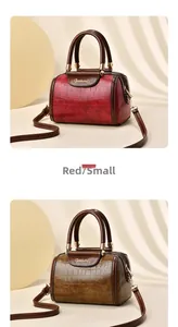 Detailed view of stone pattern Boston bags in dark red and caramel with dual handles