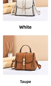 Detail view of stylish pebbled leather handbags in white and earth yellow with metal buckles