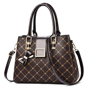 Fashionable dark coffee monogram tote bag with gold buckle and bow charm detail