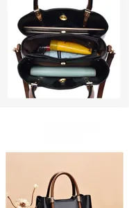 Detailed view of large capacity interior with three compartments for black tote bag