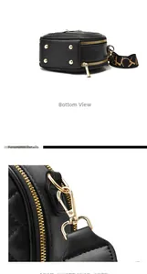 Detail of round quilted leather bag with golden anti-corrosion hardware and wide strap
