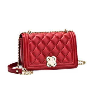 Classic red quilted shoulder bag with gold chain strap and clover twist lock for women