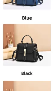 Detail of small crossbody bags in blue and black pebbled leather with metal buckle lock