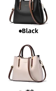 Close-up of black and beige tote bags with lychee texture and golden hardware details