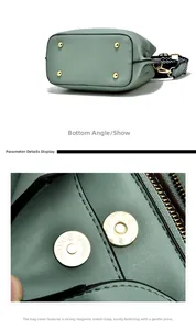 Detail view of mint green handbag featuring golden protective studs and magnetic buckle