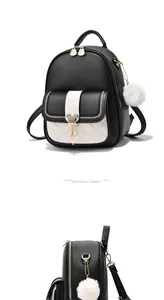 Détails du sac à dos bicolore avec poche avant matelassée et garnitures dorées chic