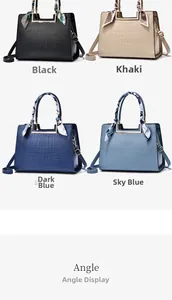 Detail of four crocodile-embossed leather handbags with decorative scarves and straps