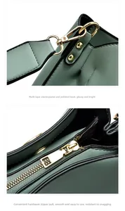 Detail of avocado green lychee leather bag with polished gold hardware and smooth zipper