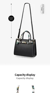 Detail of crocodile embossed handbag with gold lock, silk scarf handle and 55cm shoulder strap